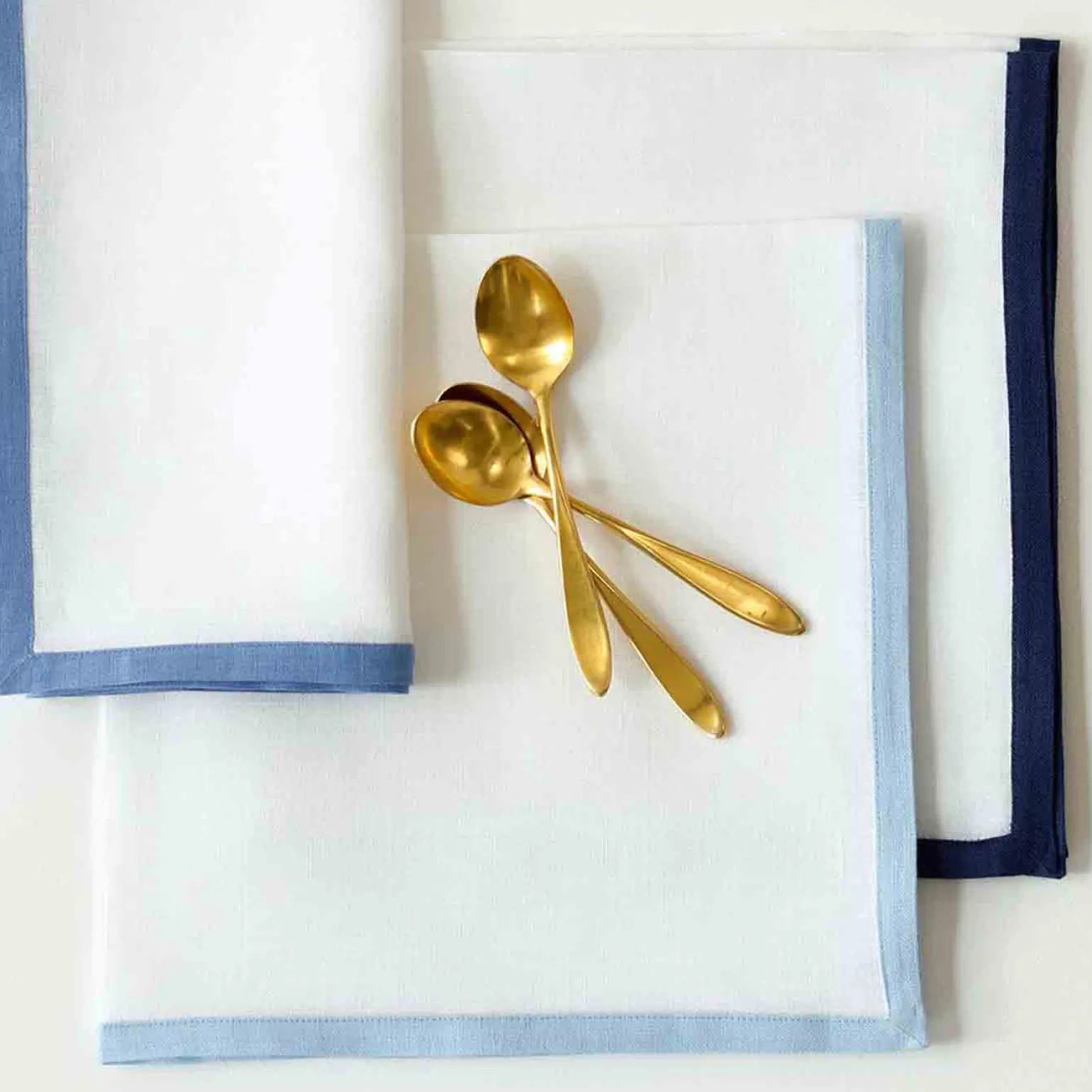 set_of_four_border_napkin_1.webp Set of Four Border Napkins Ice Blue